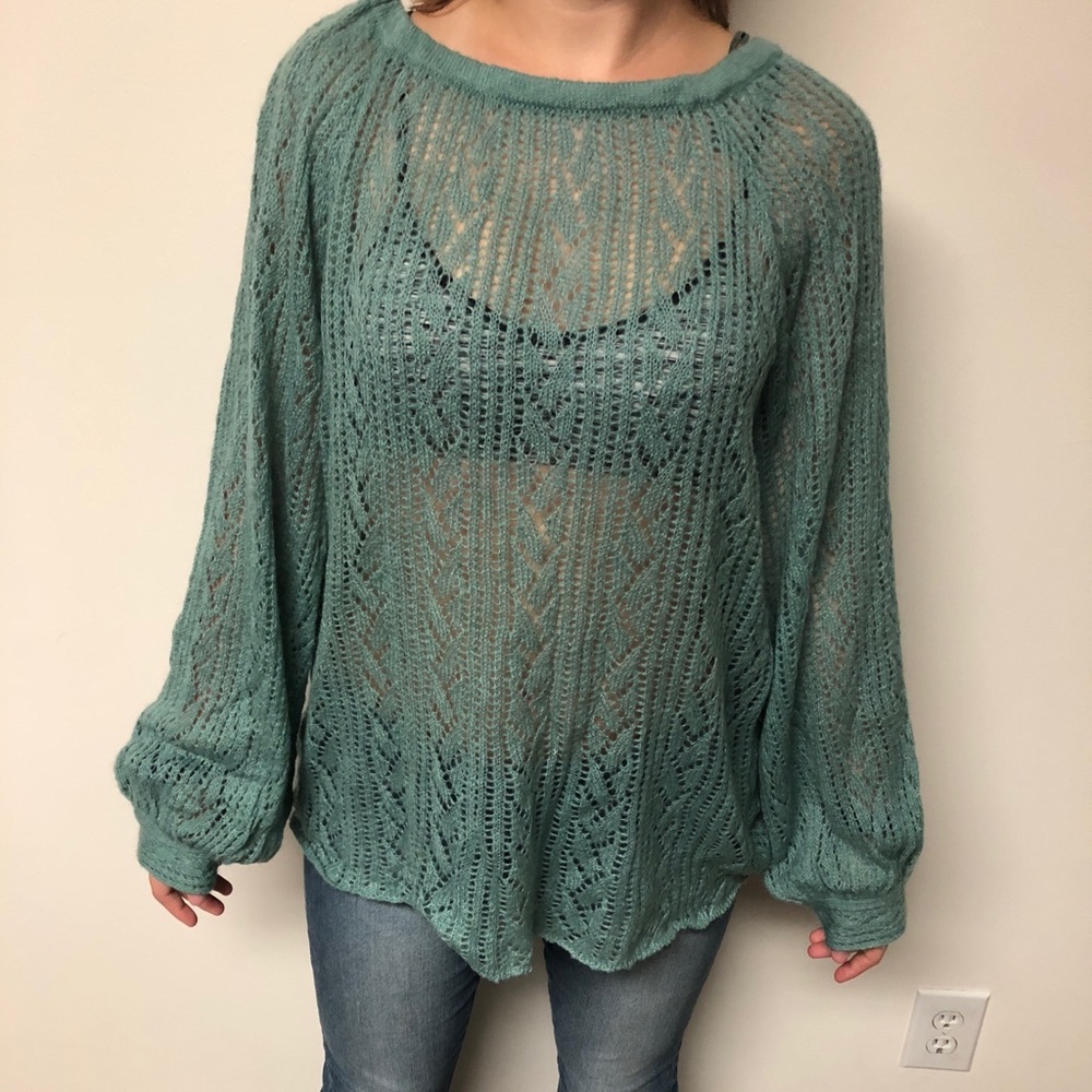Green knit top. Can be worn off the shoulders also